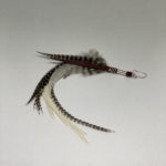 Grizzly and white rooster feather statement ear ring