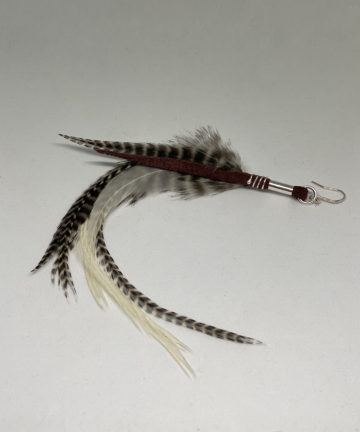 Grizzly and white rooster feather statement ear ring
